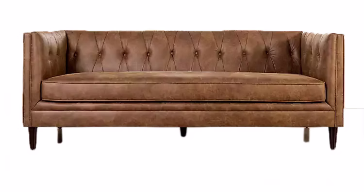 Brown tufted leather sofa with high, cushioned arms and back, featuring button detailing and wooden legs, viewed from the front against a white background.