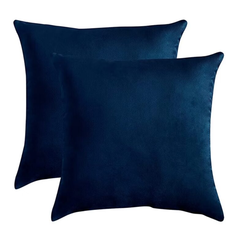 Two square, dark blue velvet throw pillows are stacked slightly overlapping on a plain white background.