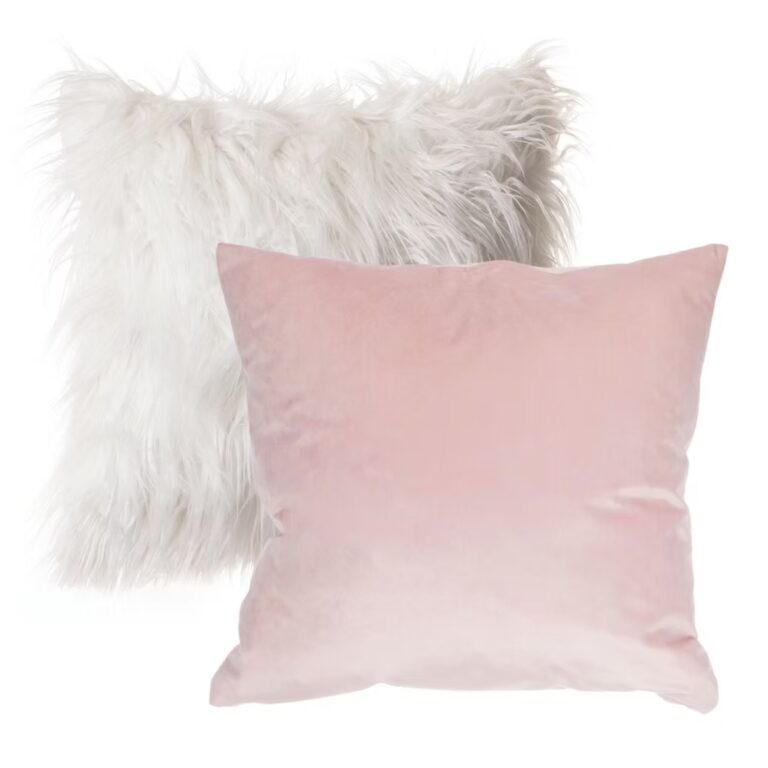 Two decorative pillows: one is fluffy and white, while the other is smooth and light pink. Both are square-shaped and placed overlapping on a plain white background.