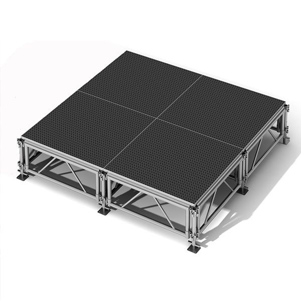 A modular, elevated stage platform with four black, textured panels supported by a metal frame and adjustable legs—perfect for events where you also rent tables, linens, and chairs for your holiday party. Shown on a white background.