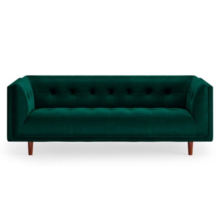 A modern, deep green velvet sofa with a tufted back and seat, square arms, and wooden tapered legs, shown against a white background—perfect inspiration as you rent tables, linens, and chairs for your holiday party.